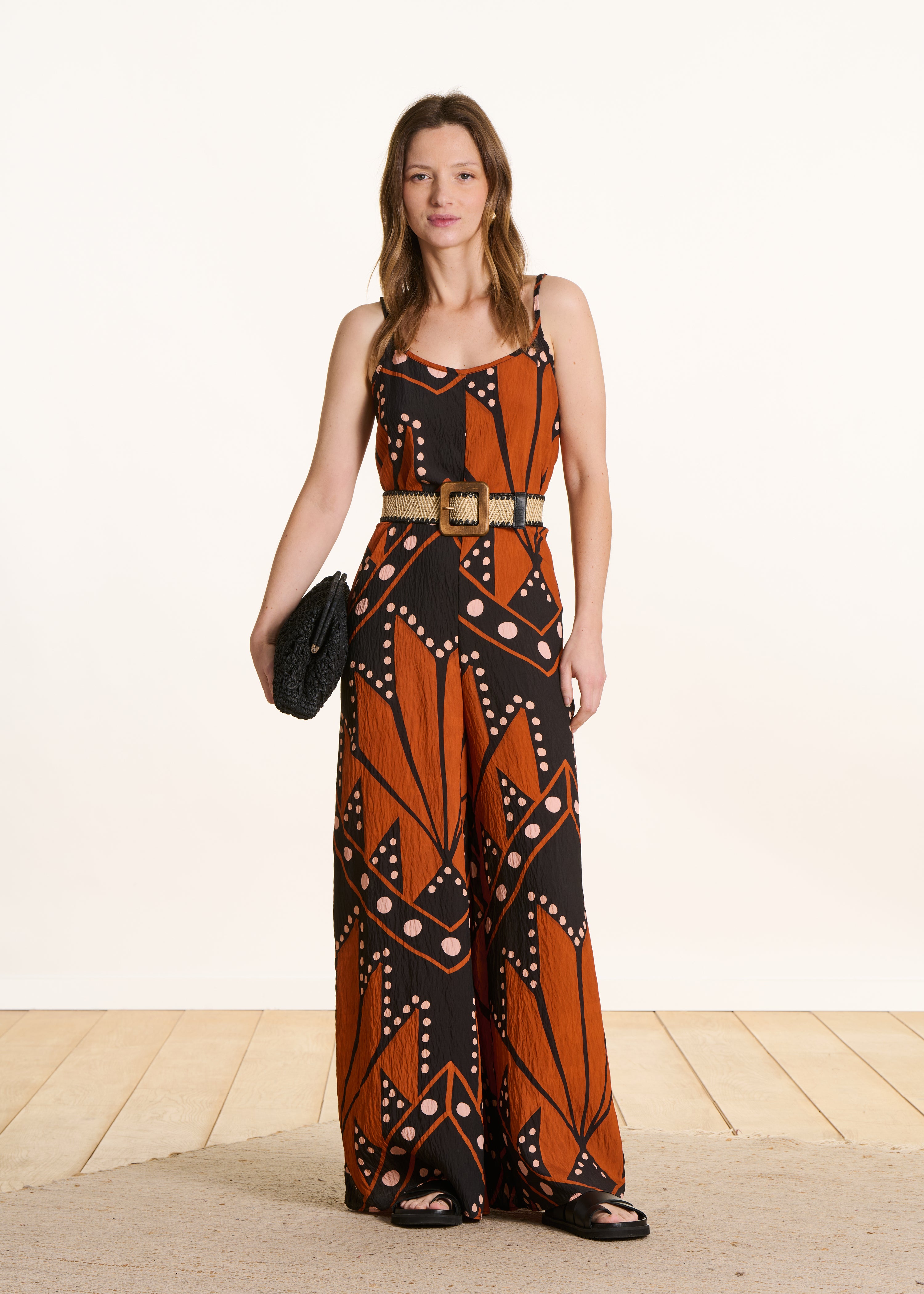 Loose long jumpsuit with straps, black and orange print