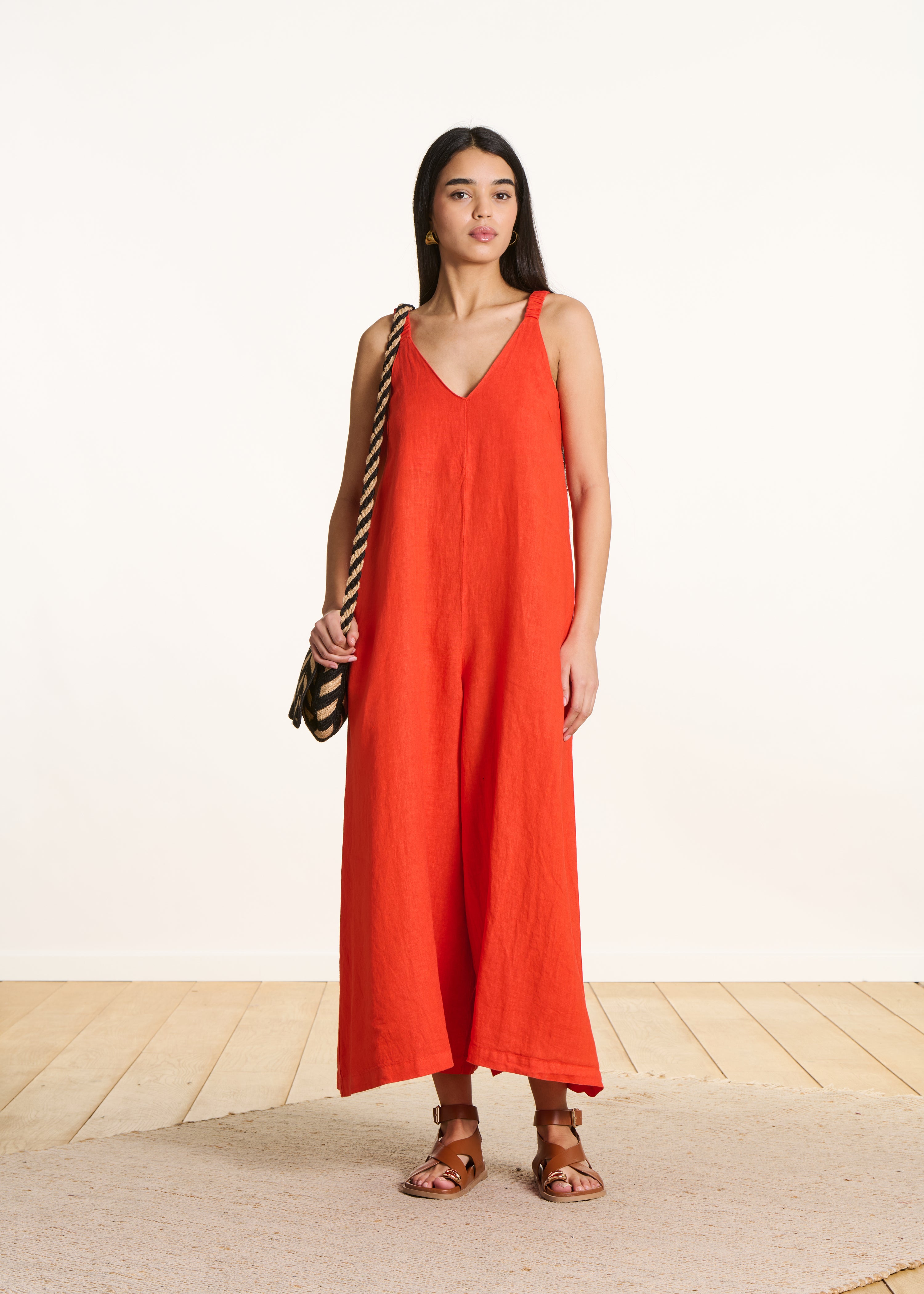 Orange linen jumpsuit with elastic straps
