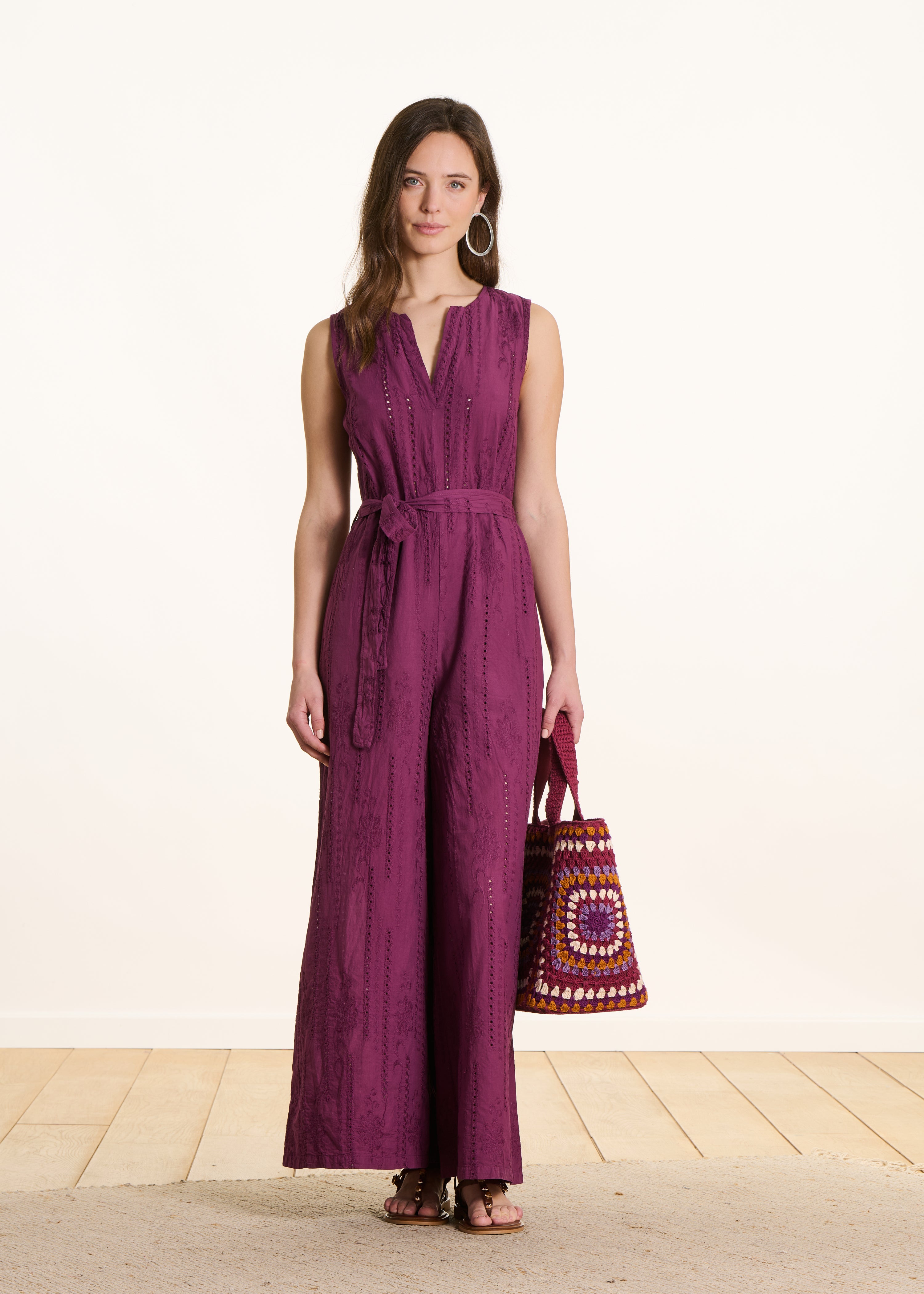 Purple jumpsuit in eyelet embroidery