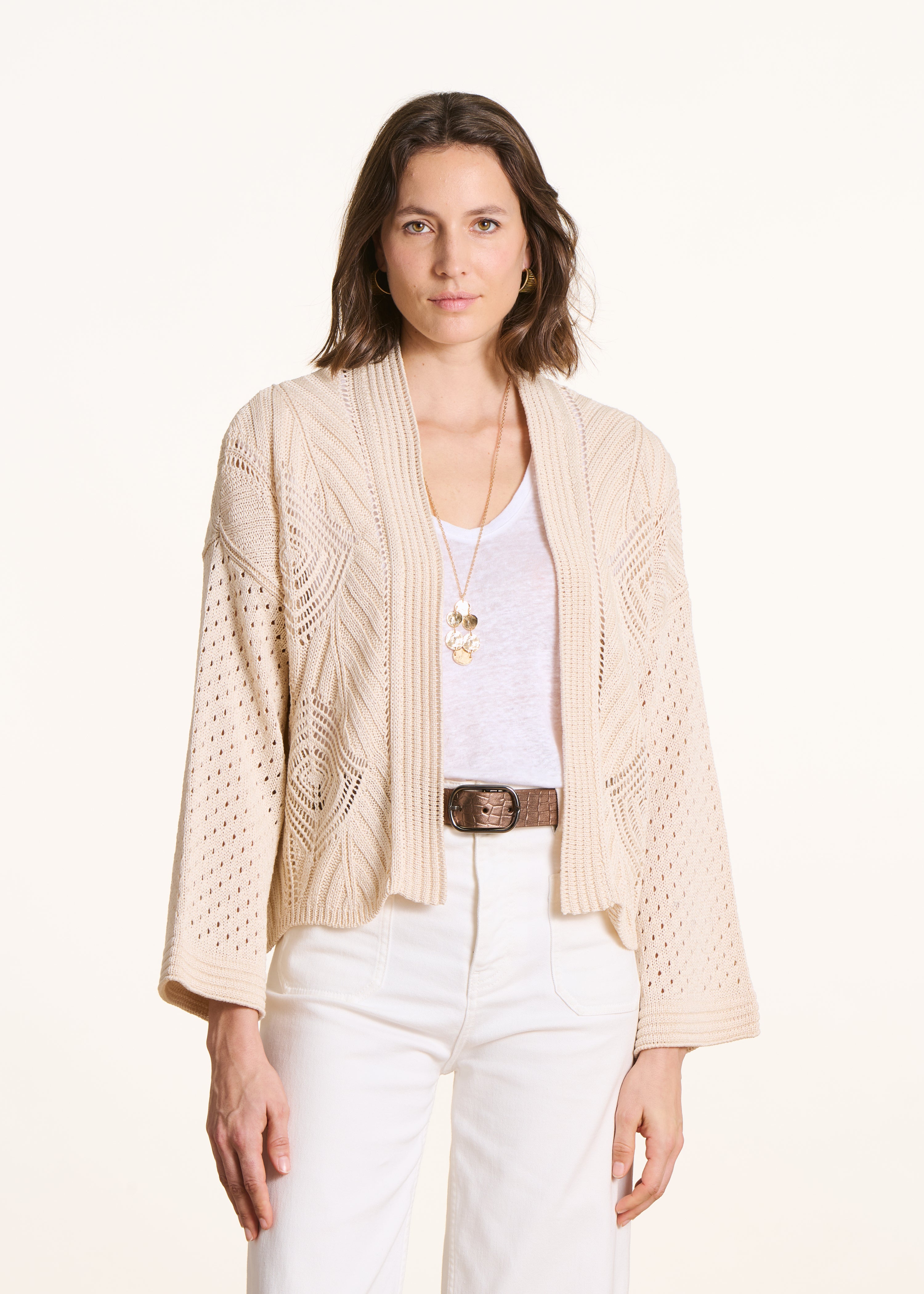 Open ecru vest in openwork crochet knit