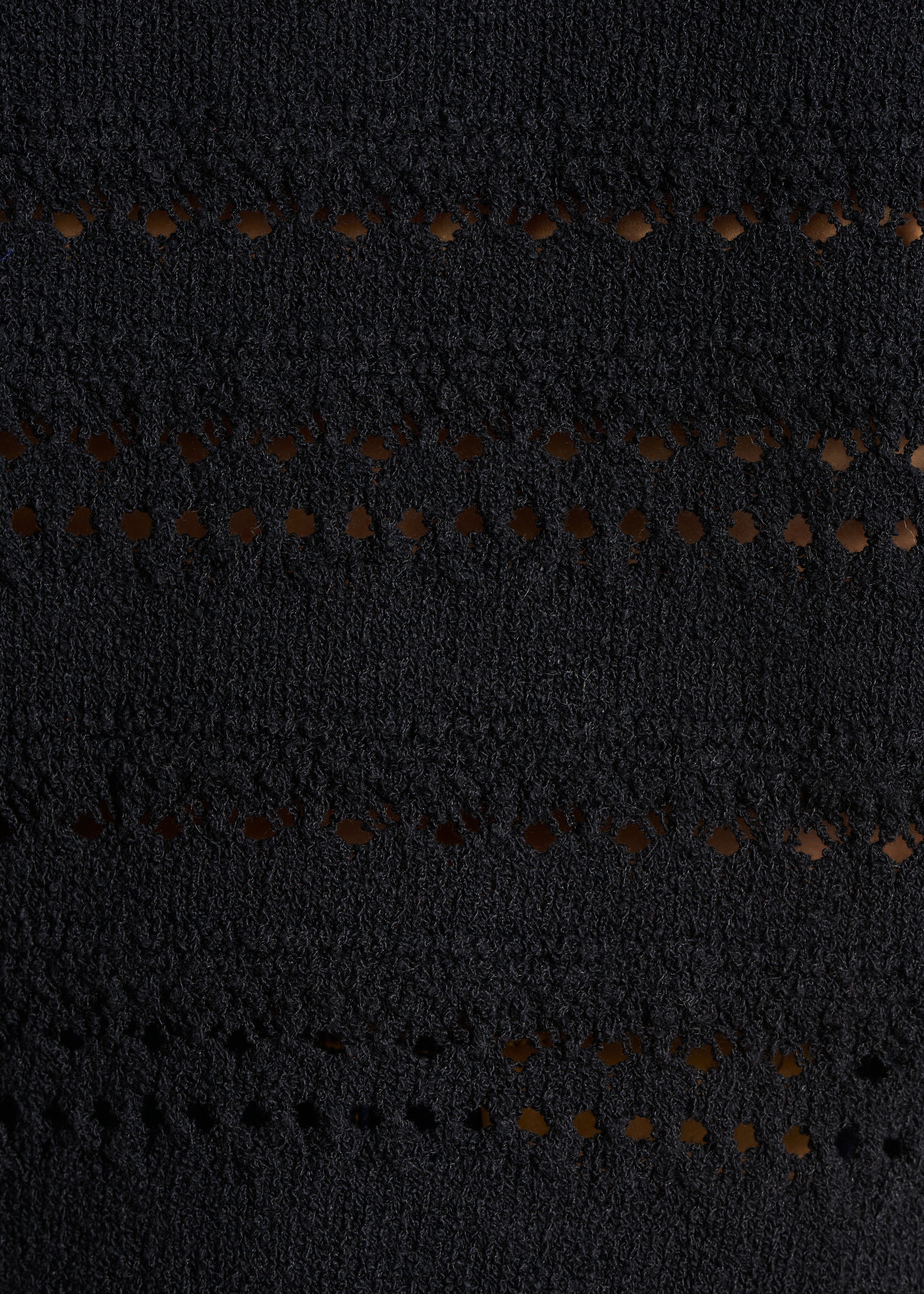 Gilet nero in maglia traforata con bottoni decorativi