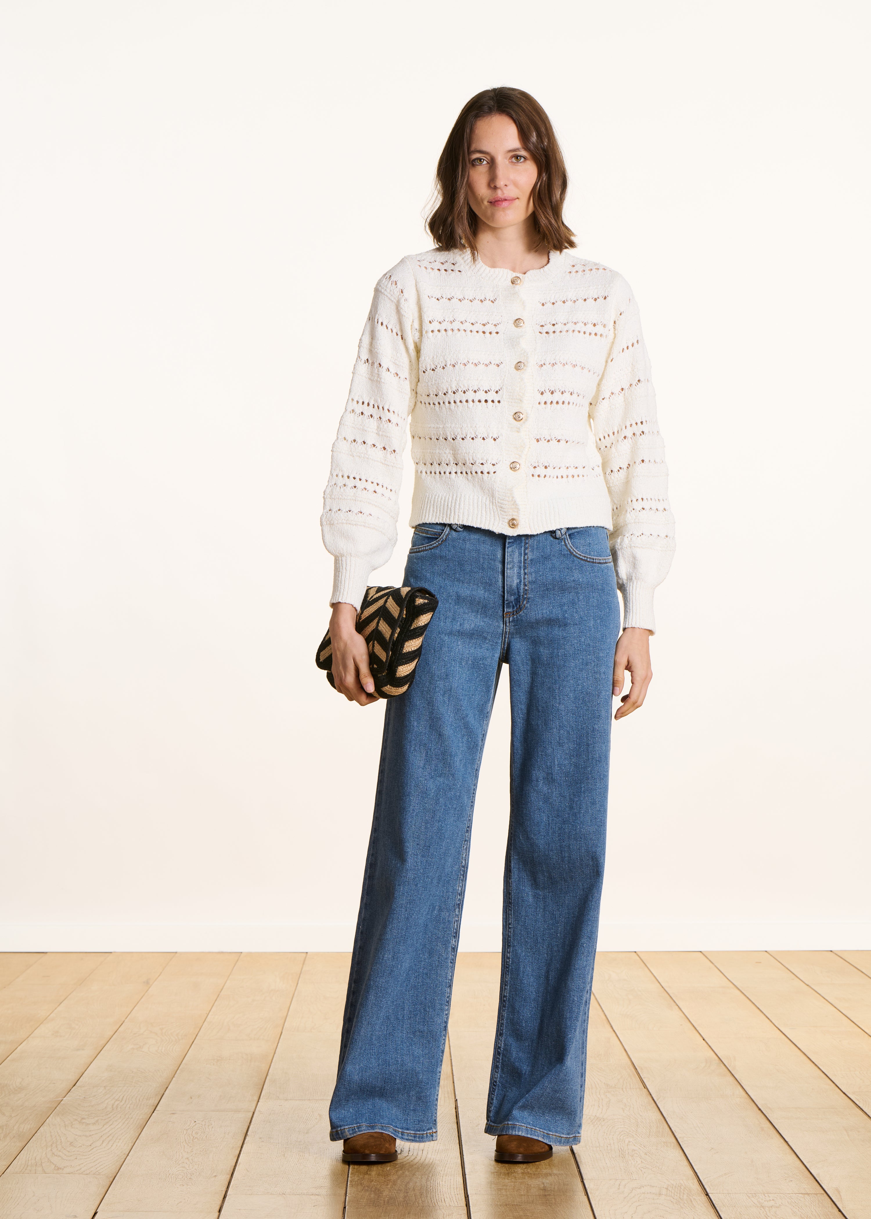 Ecru openwork knit cardigan with decorative buttons