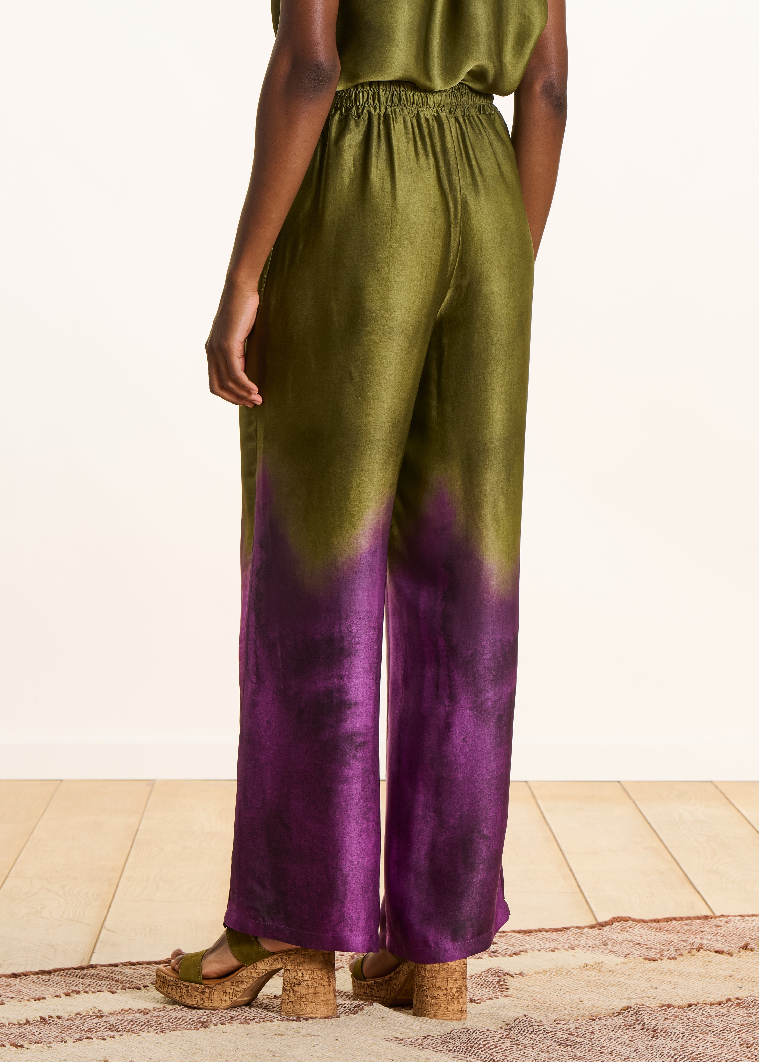 Wide green satin pants with tie-dye print