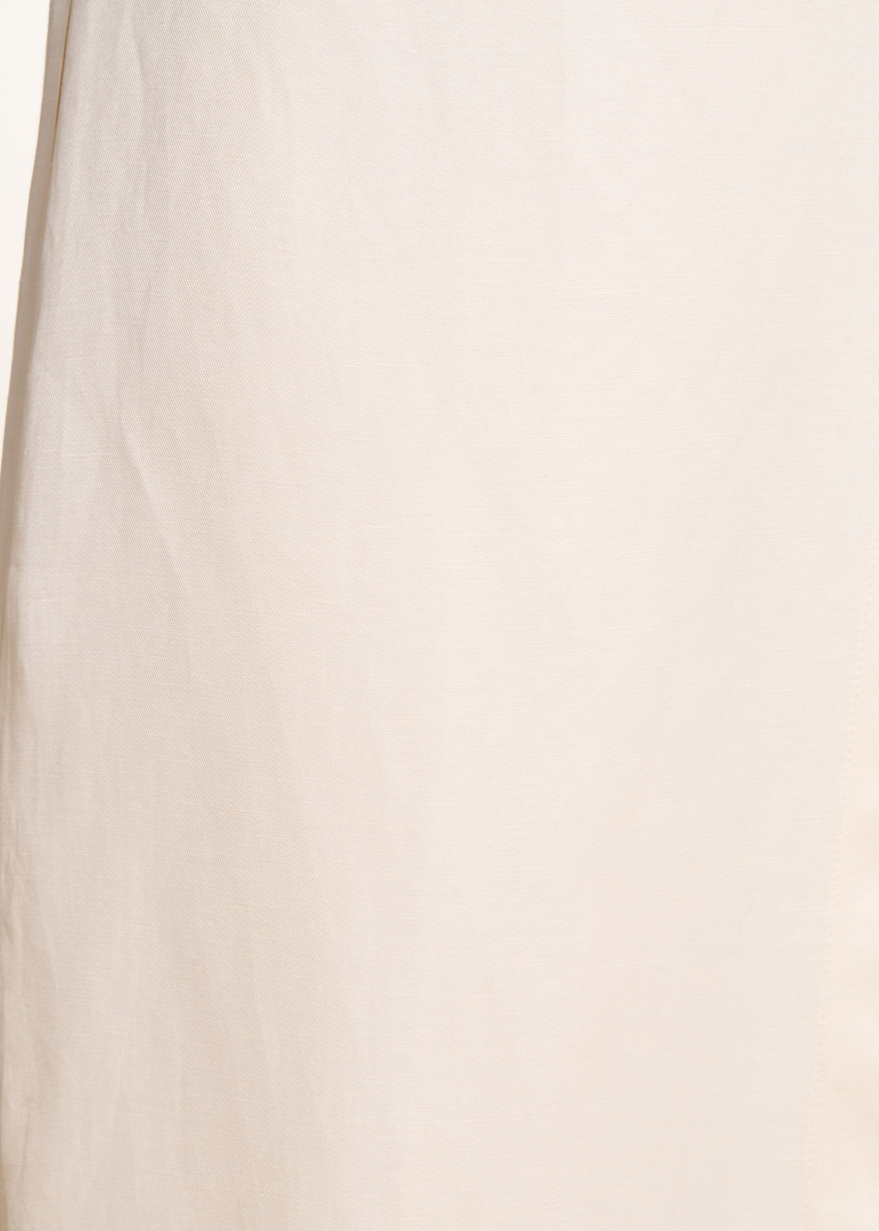 High-waisted 7/8-length ivory pants with side slit