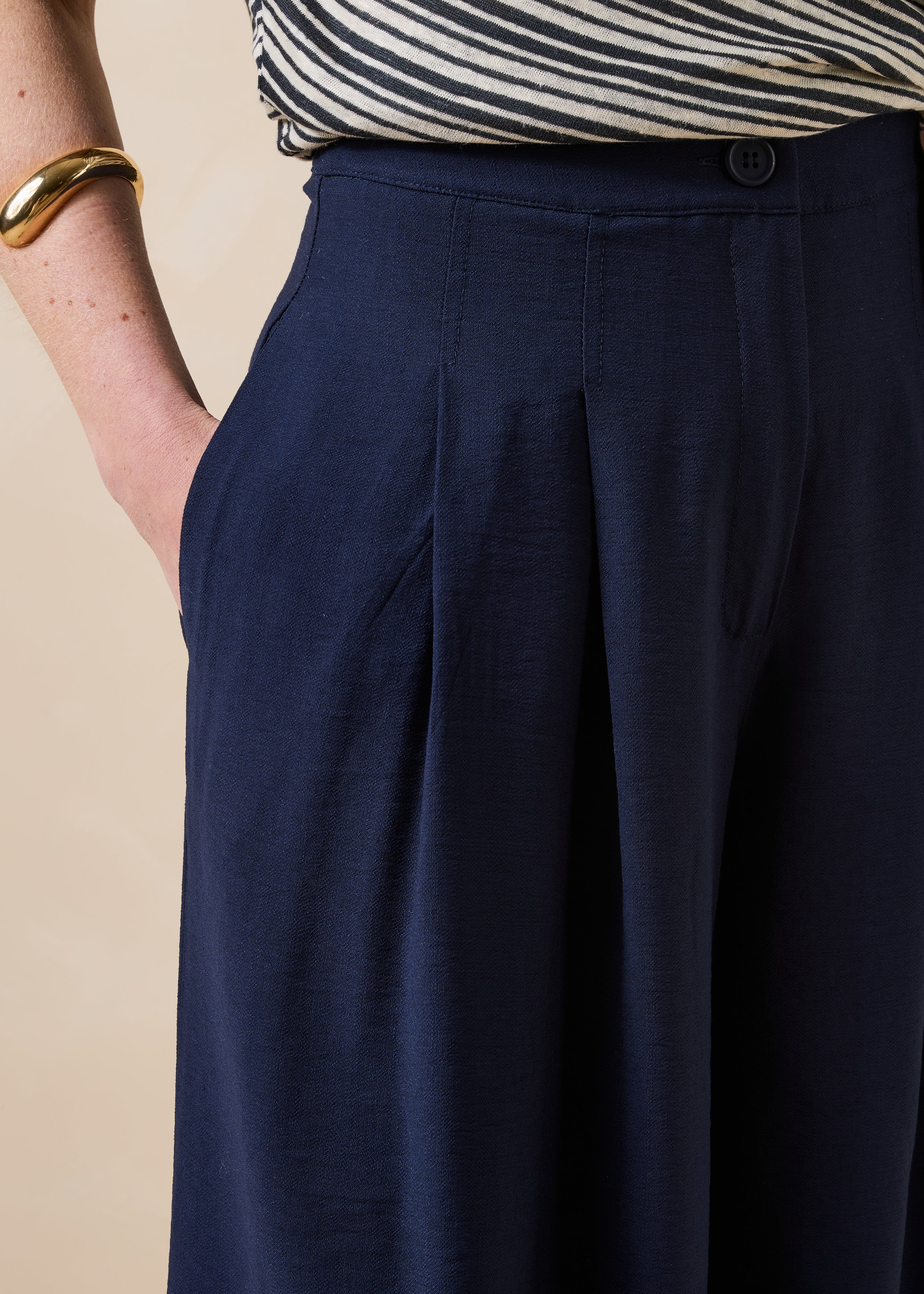 Long high-waisted navy blue trousers