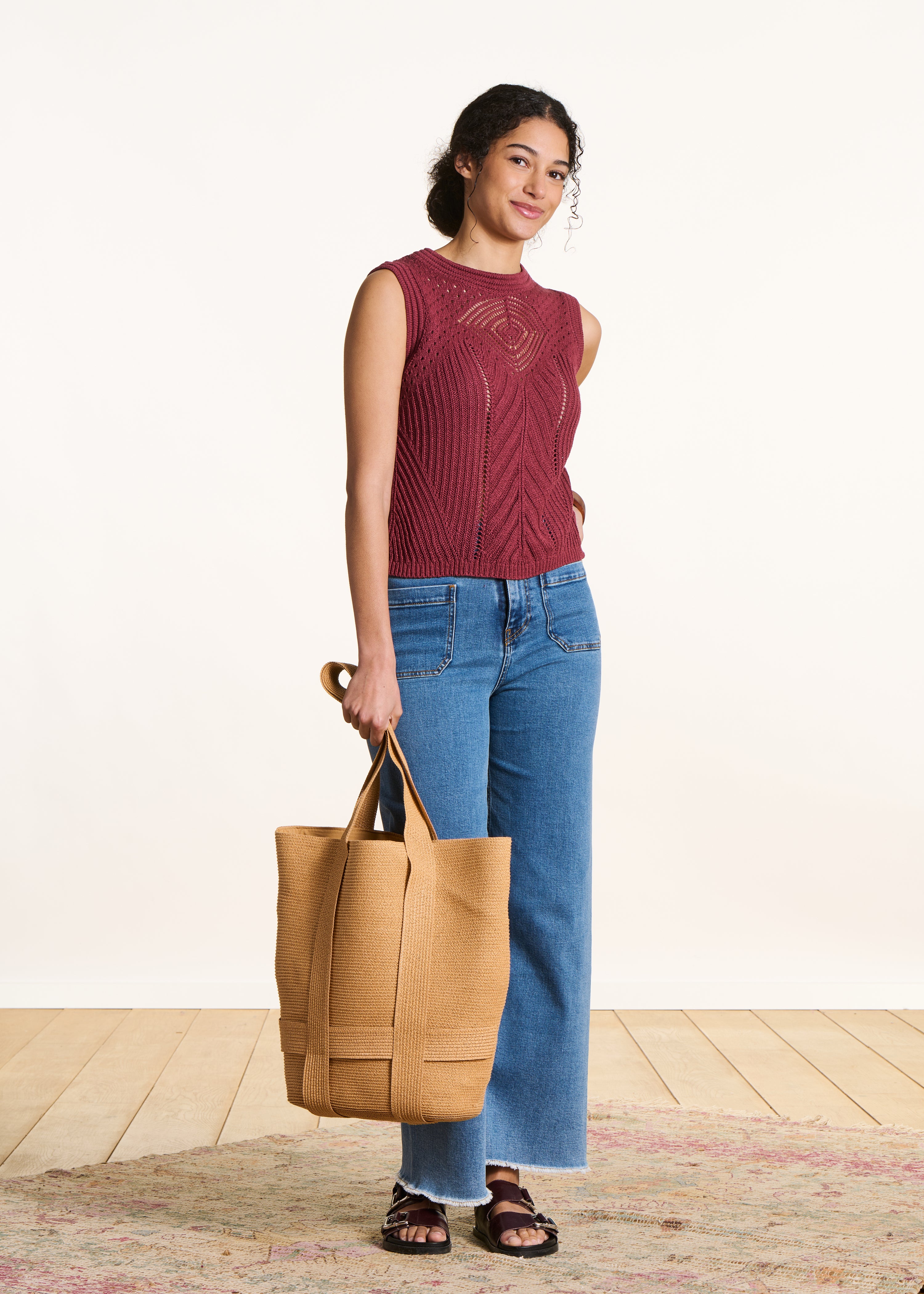 Sleeveless burgundy sweater in openwork crochet knit