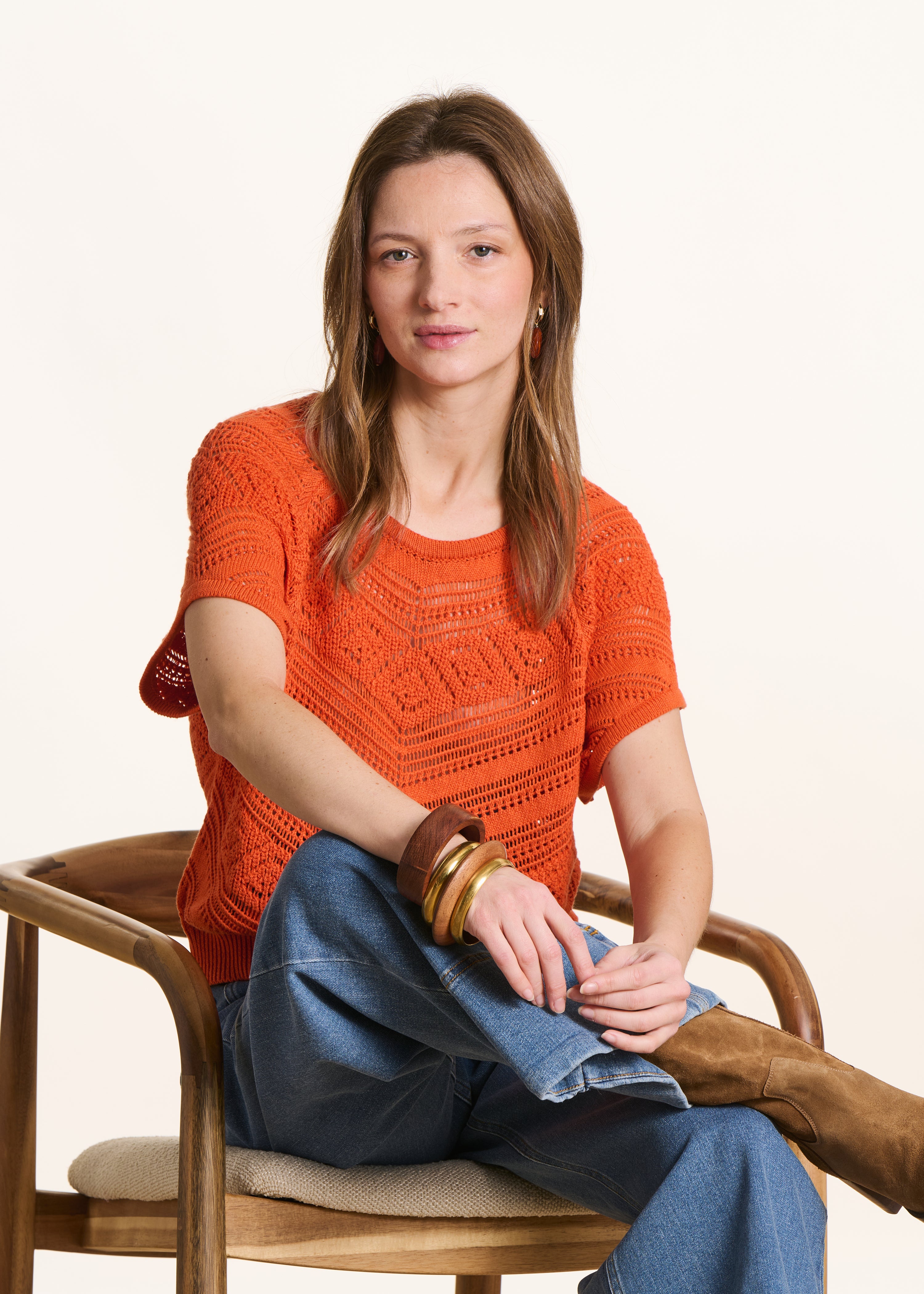 Short-sleeved orange sweater in openwork knit