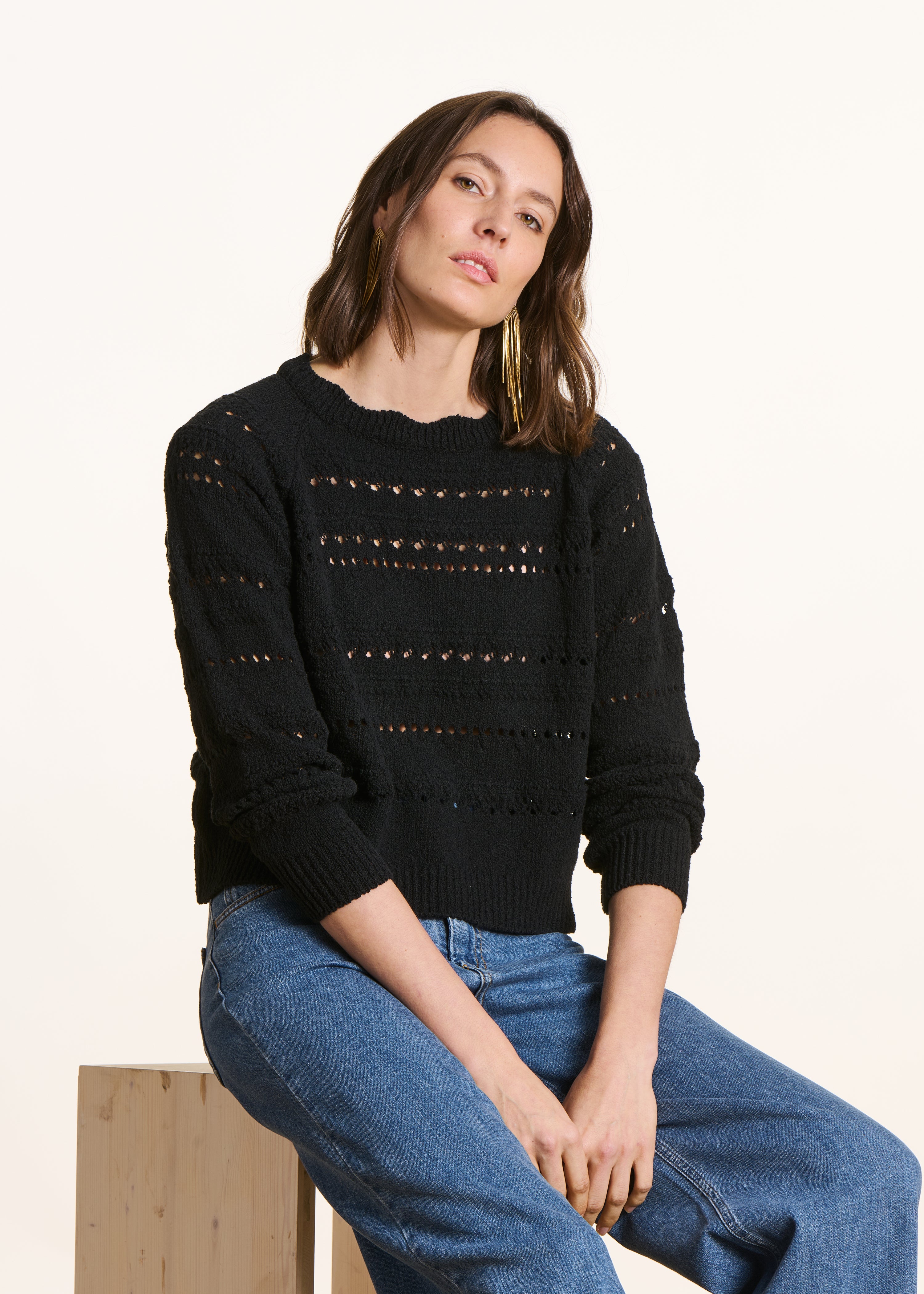 Black openwork knit sweater with long sleeves