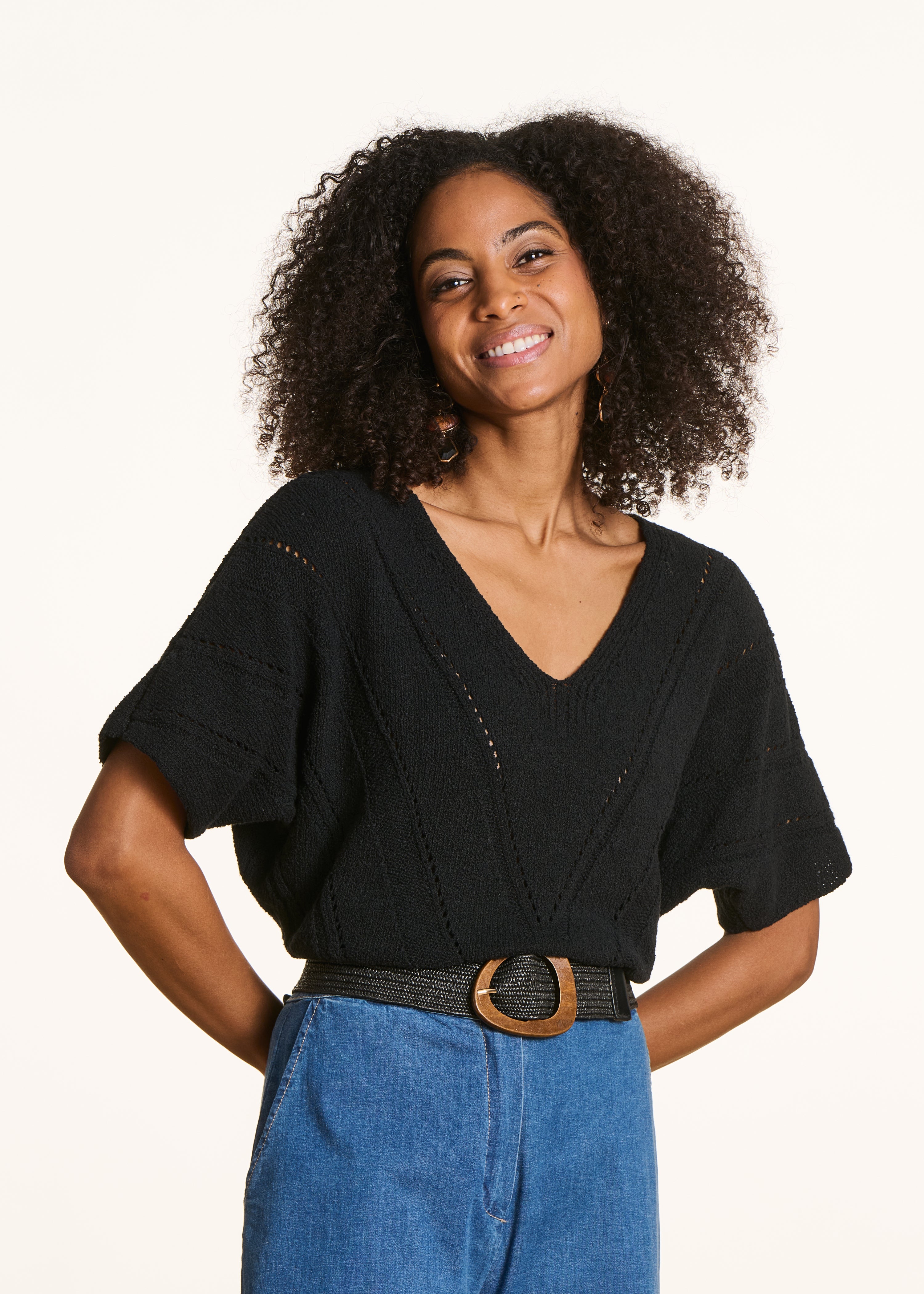 Loose black sweater in openwork knit with short sleeves