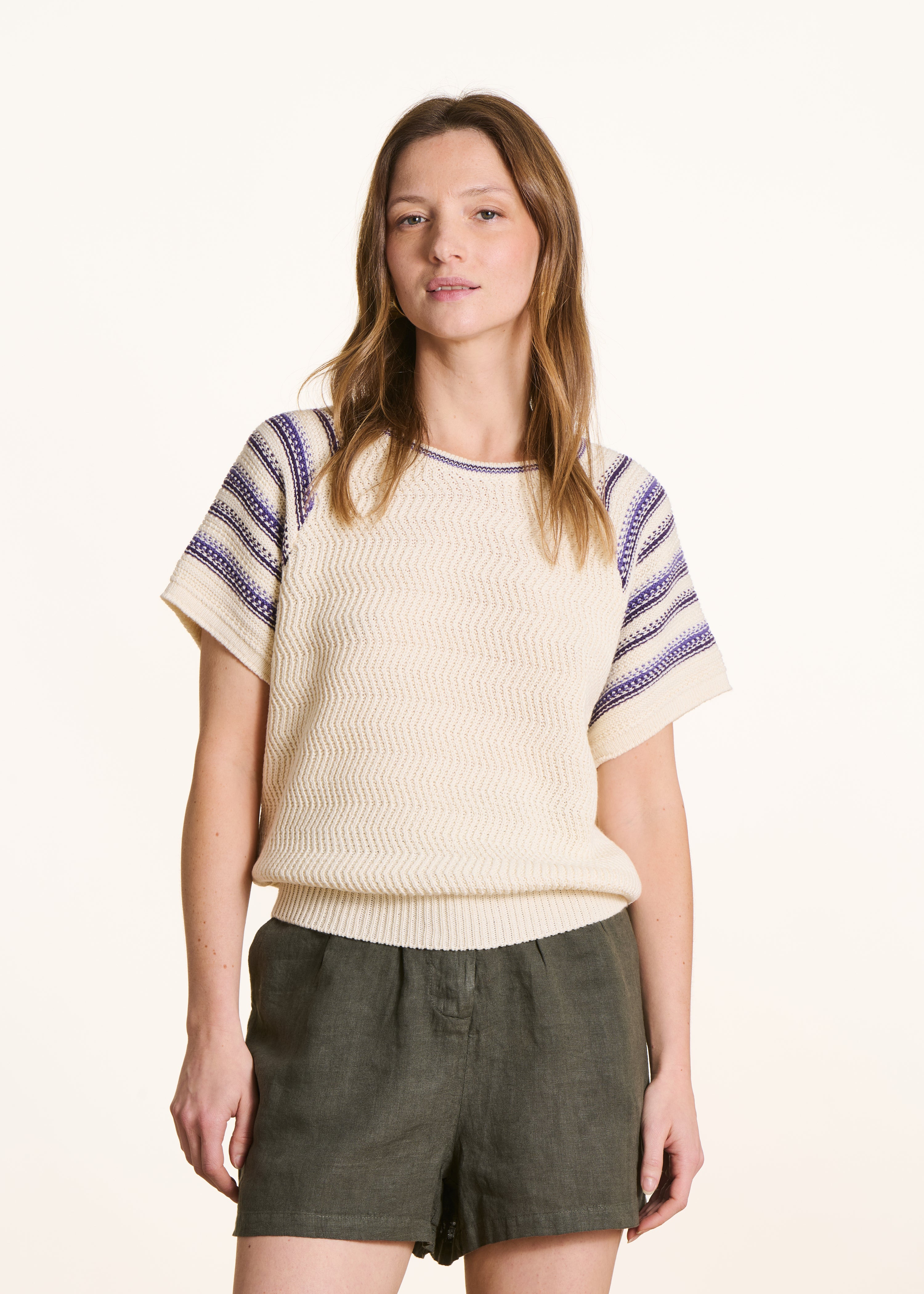 Off-white short-sleeve sweater with purple stripes