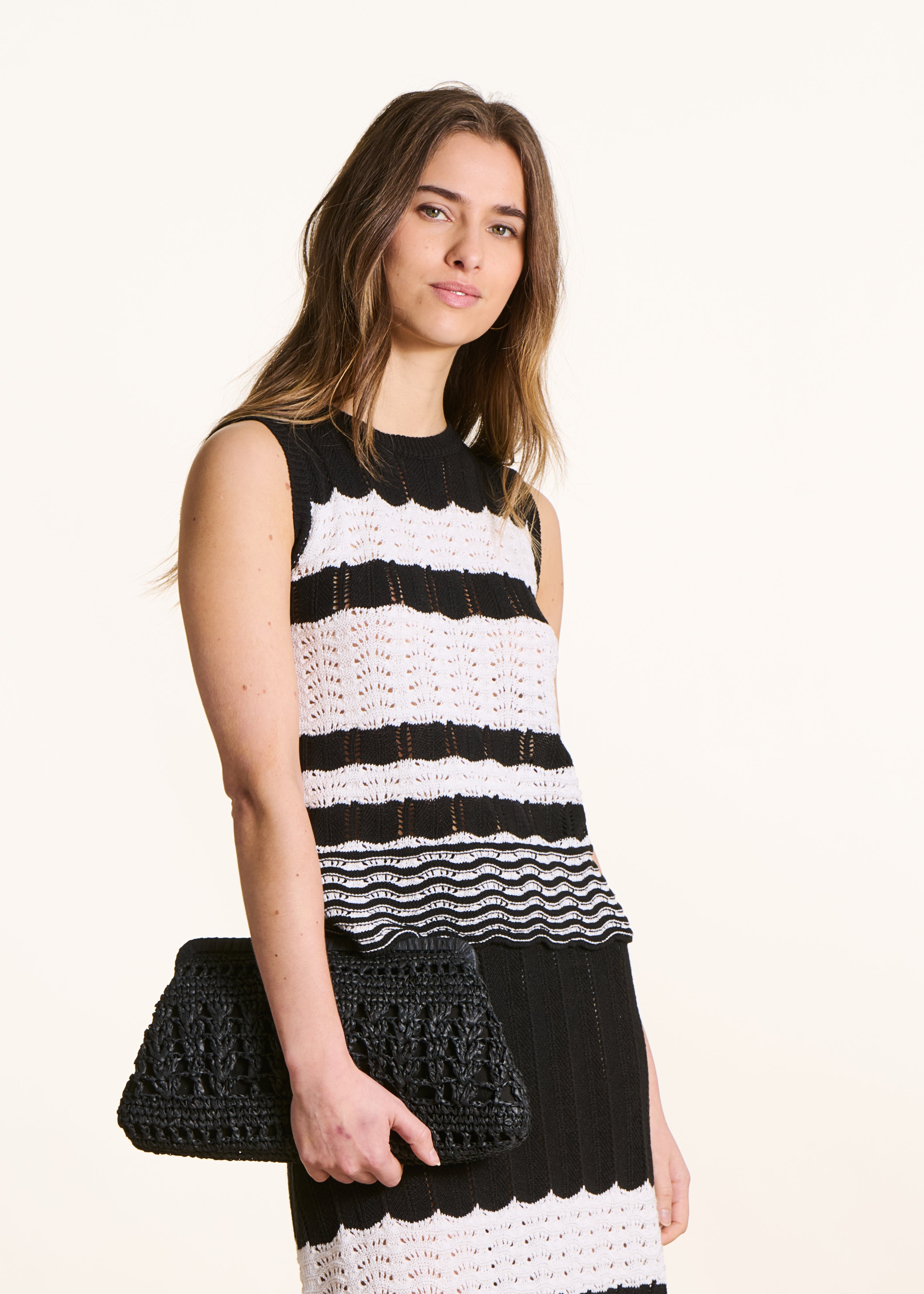 Black sweater in openwork striped knit