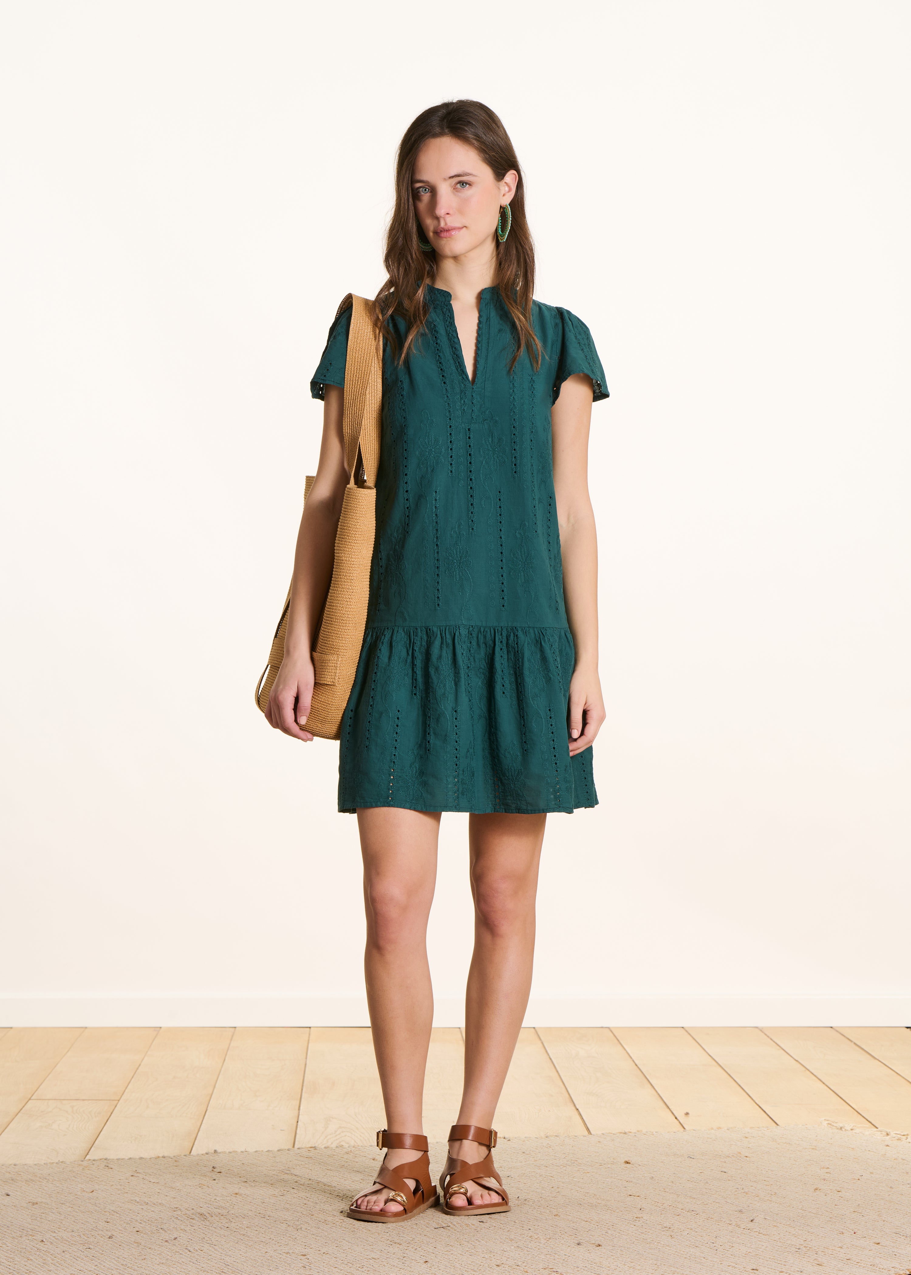 Dark green short dress in eyelet embroidery with ruffle