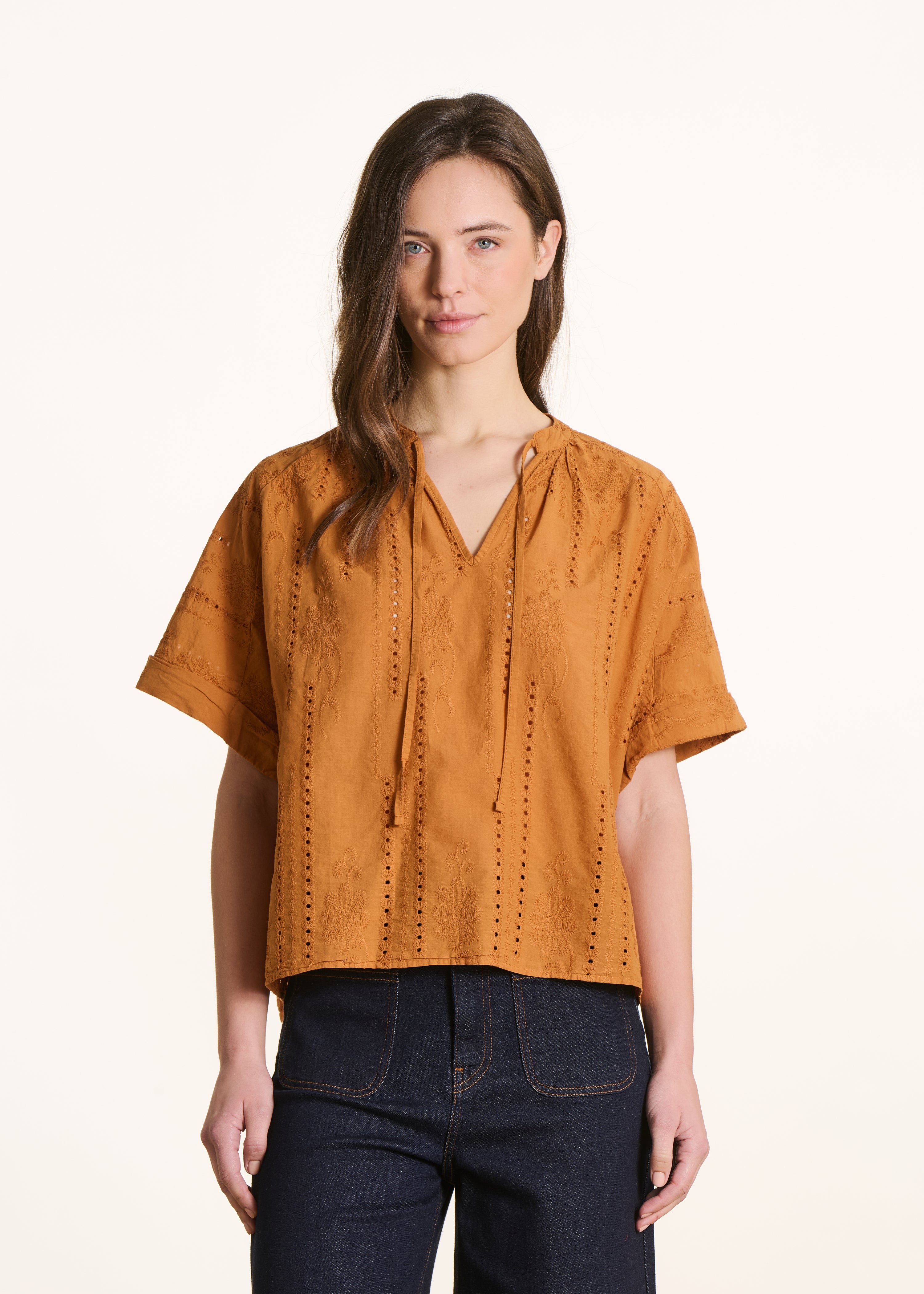 Loose ochre blouse in eyelet embroidery