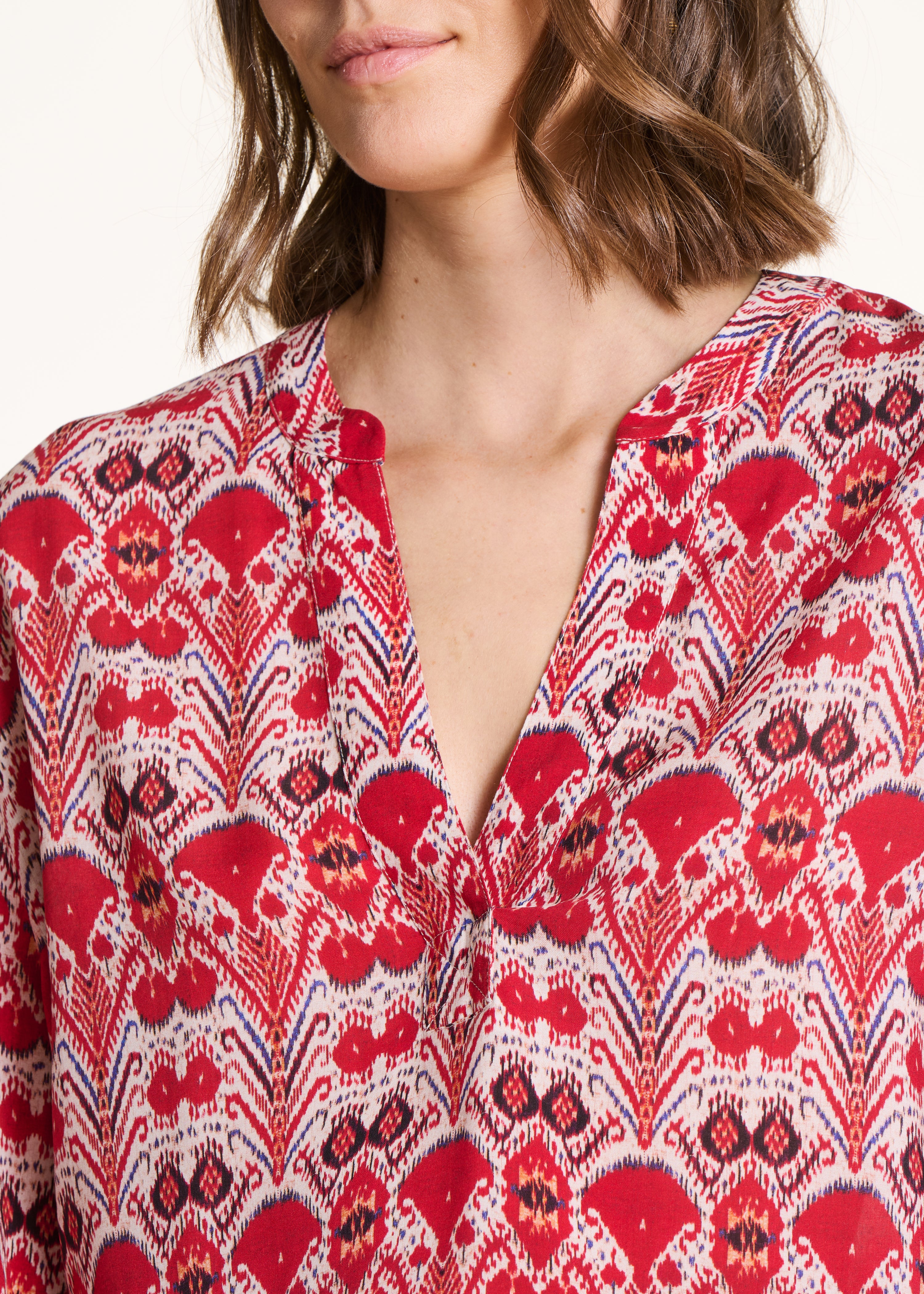 Loose red top with printed long sleeves