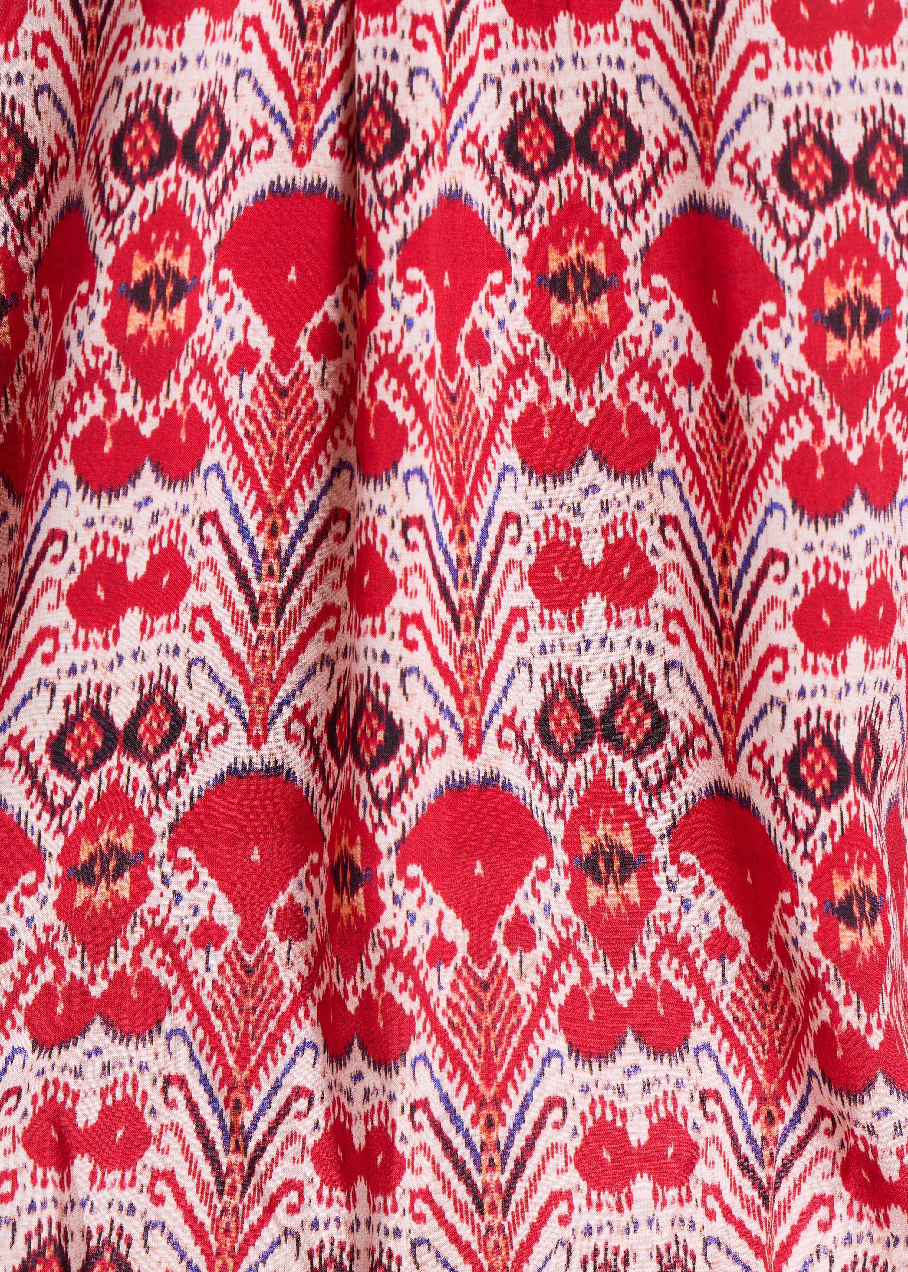 Loose red top with printed long sleeves