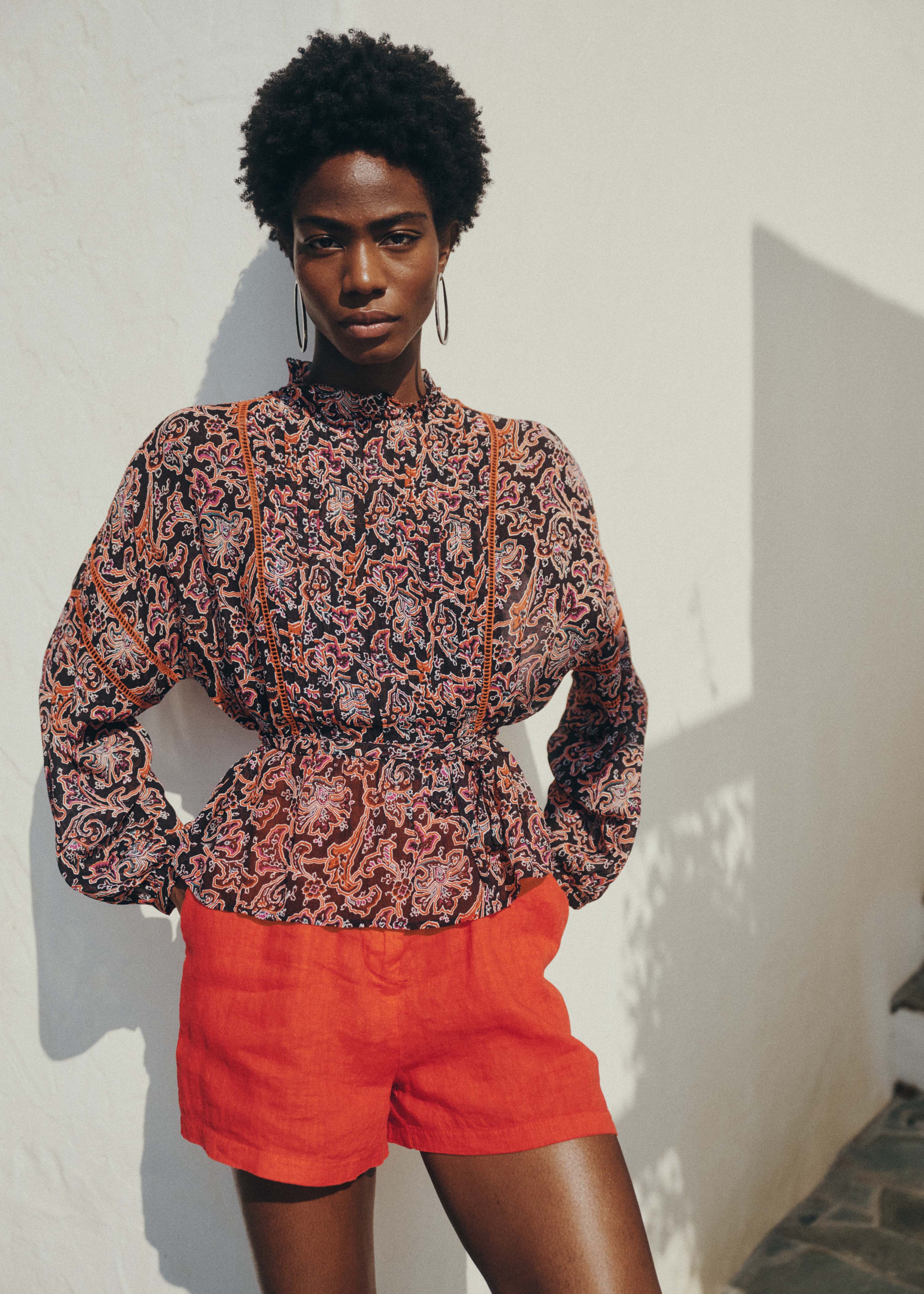 Black long-sleeve blouse with floral print