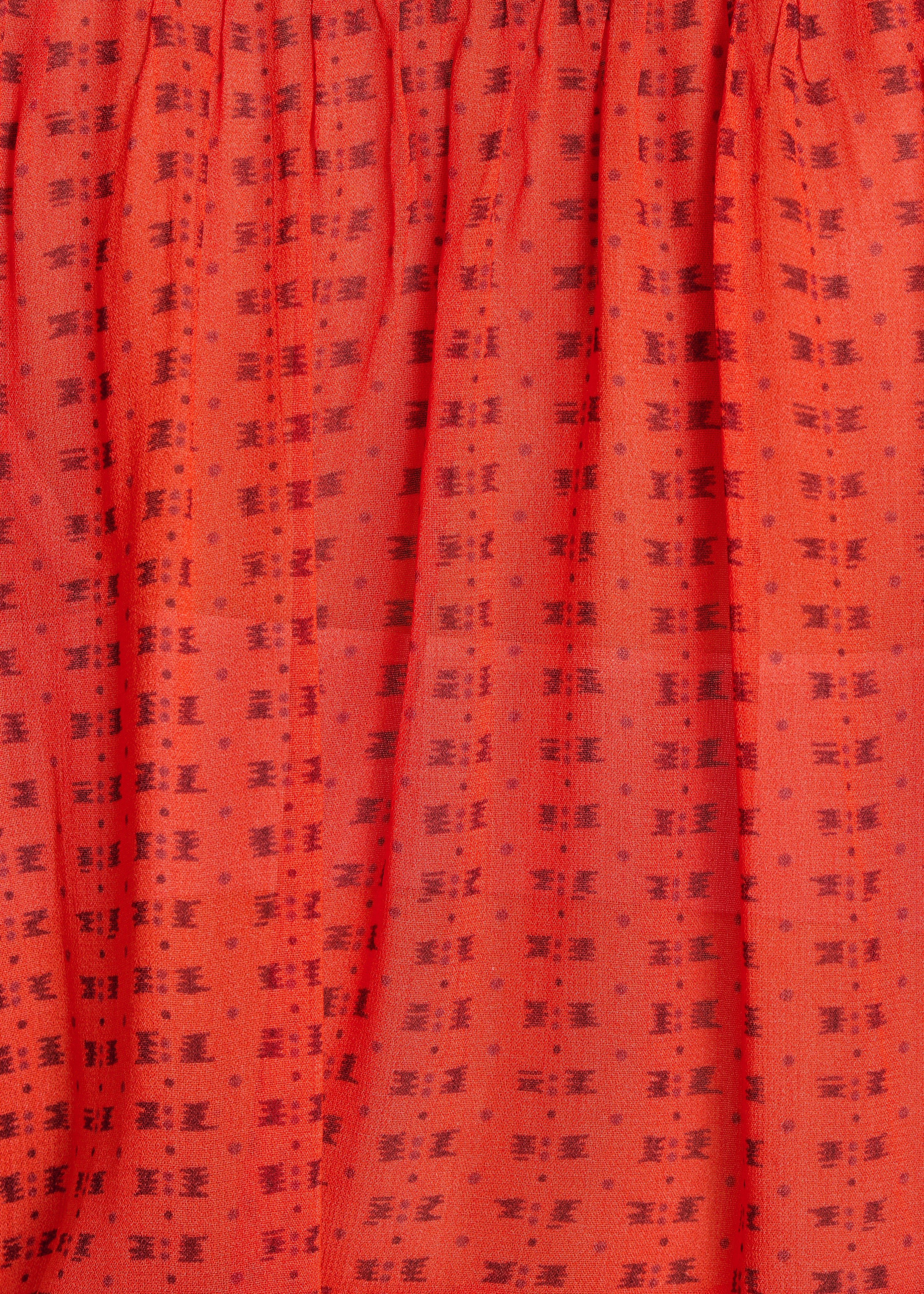 Weite orange Bluse mit Muster