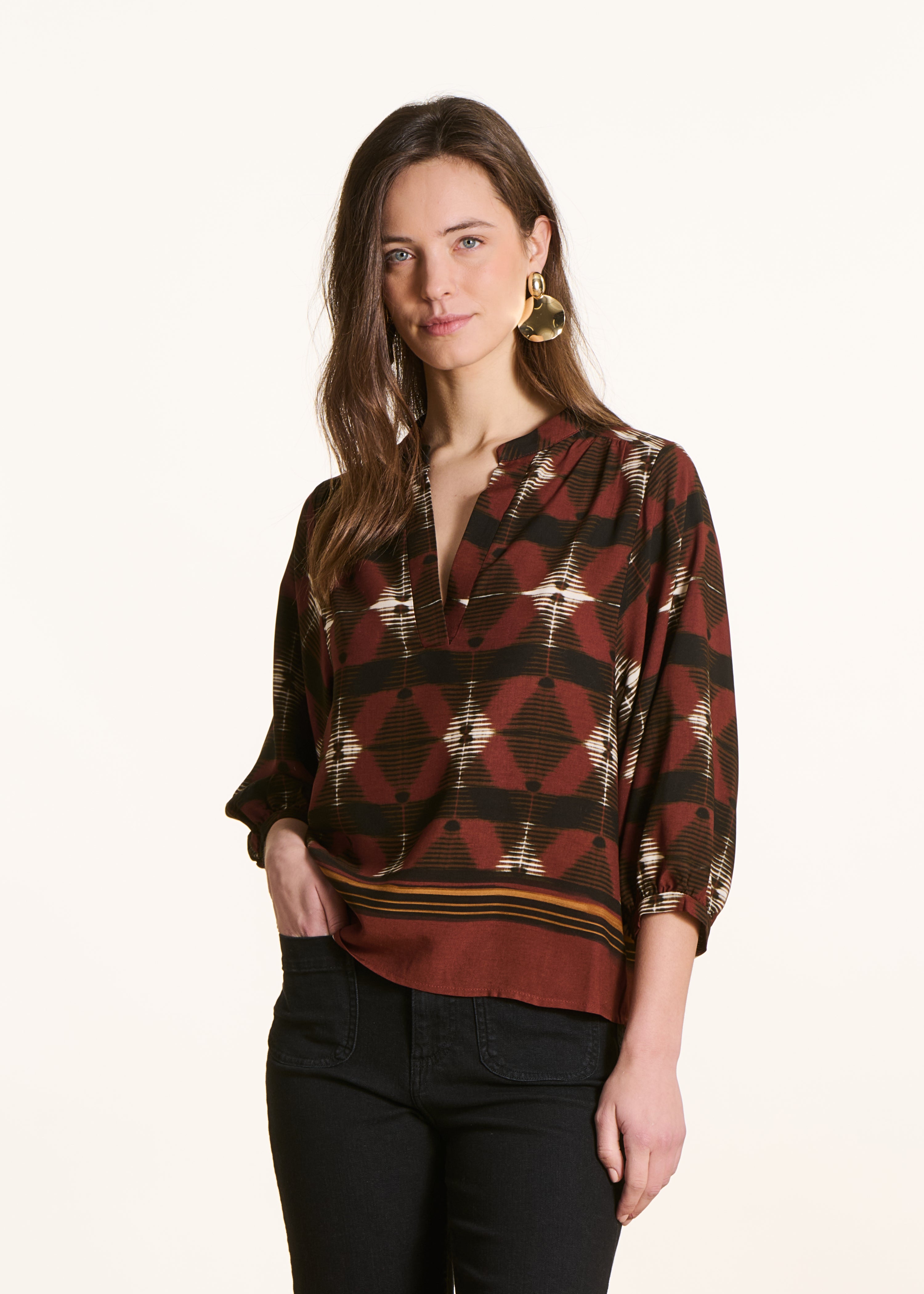 Brown top with 3/4 sleeves and print