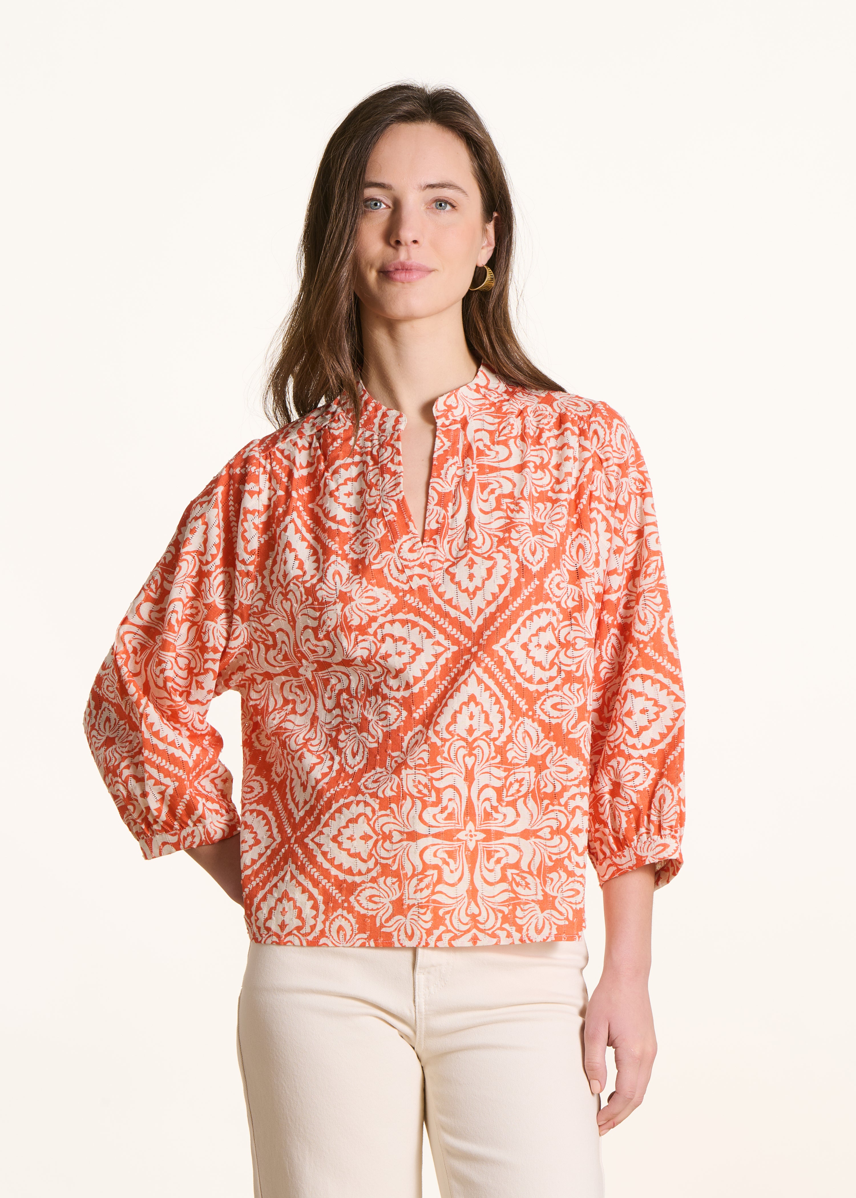 Orange openwork top with floral print and 3/4 sleeves