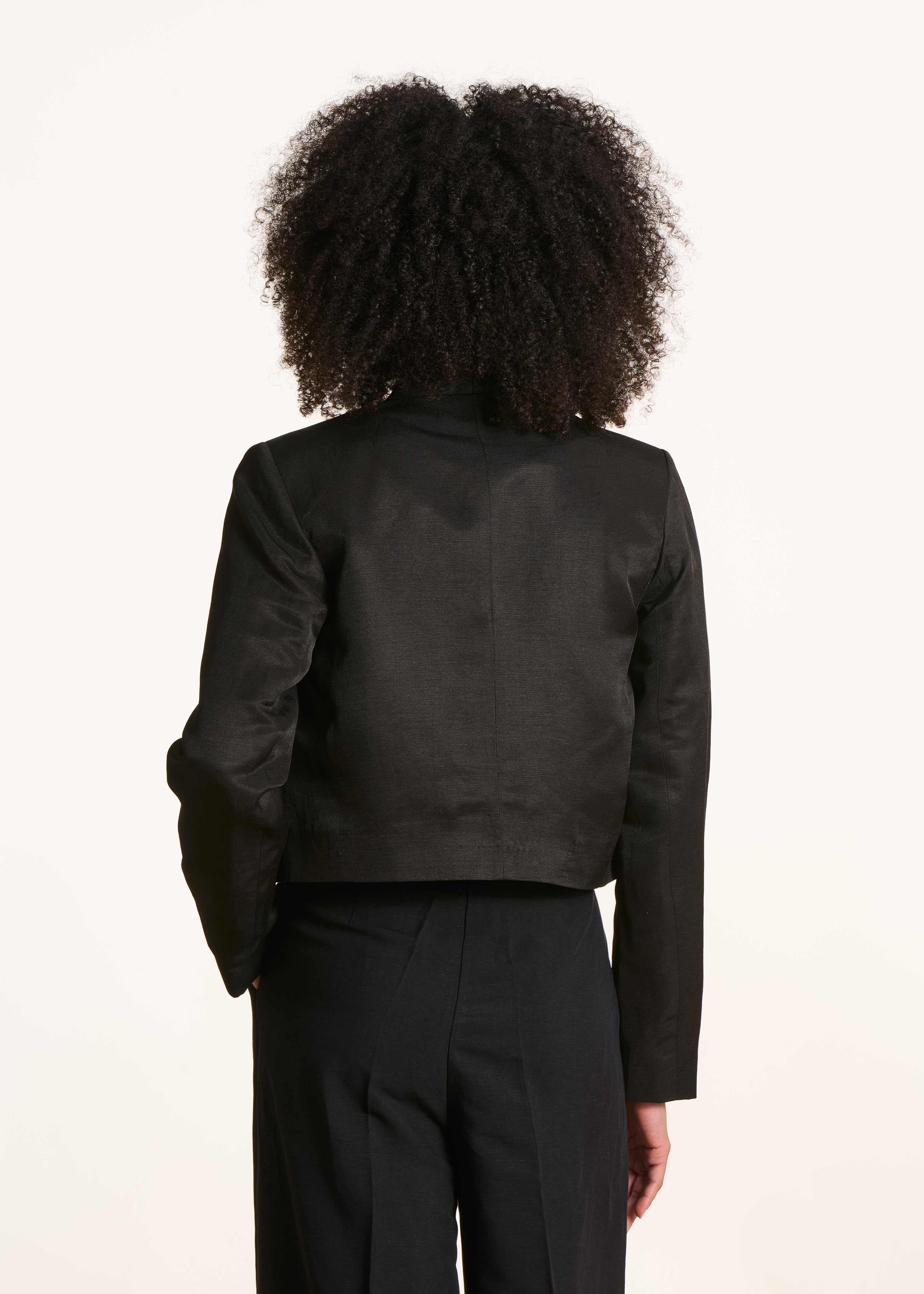 Open short shimmering black jacket