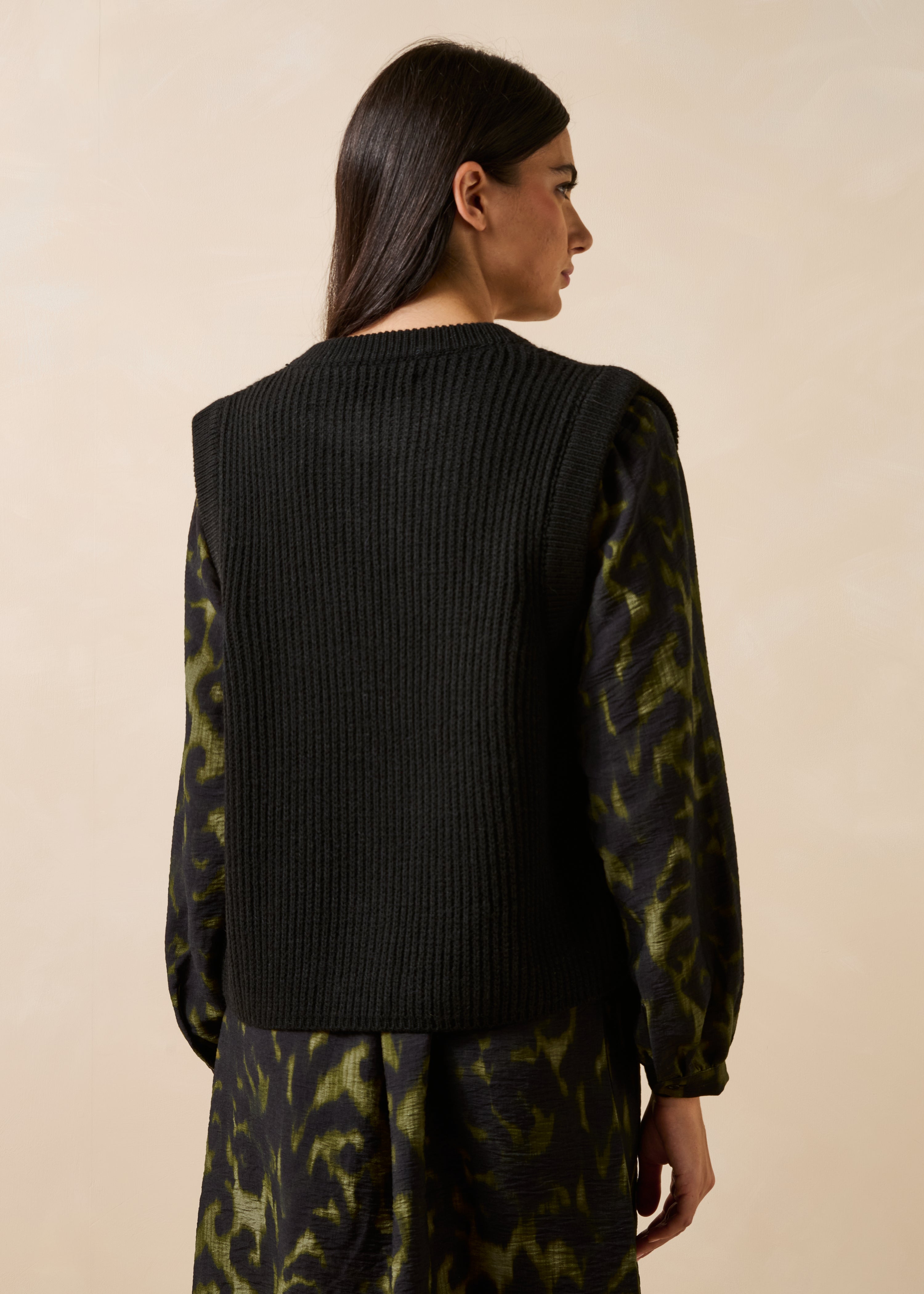 Black sleeveless cardigan with round neckline