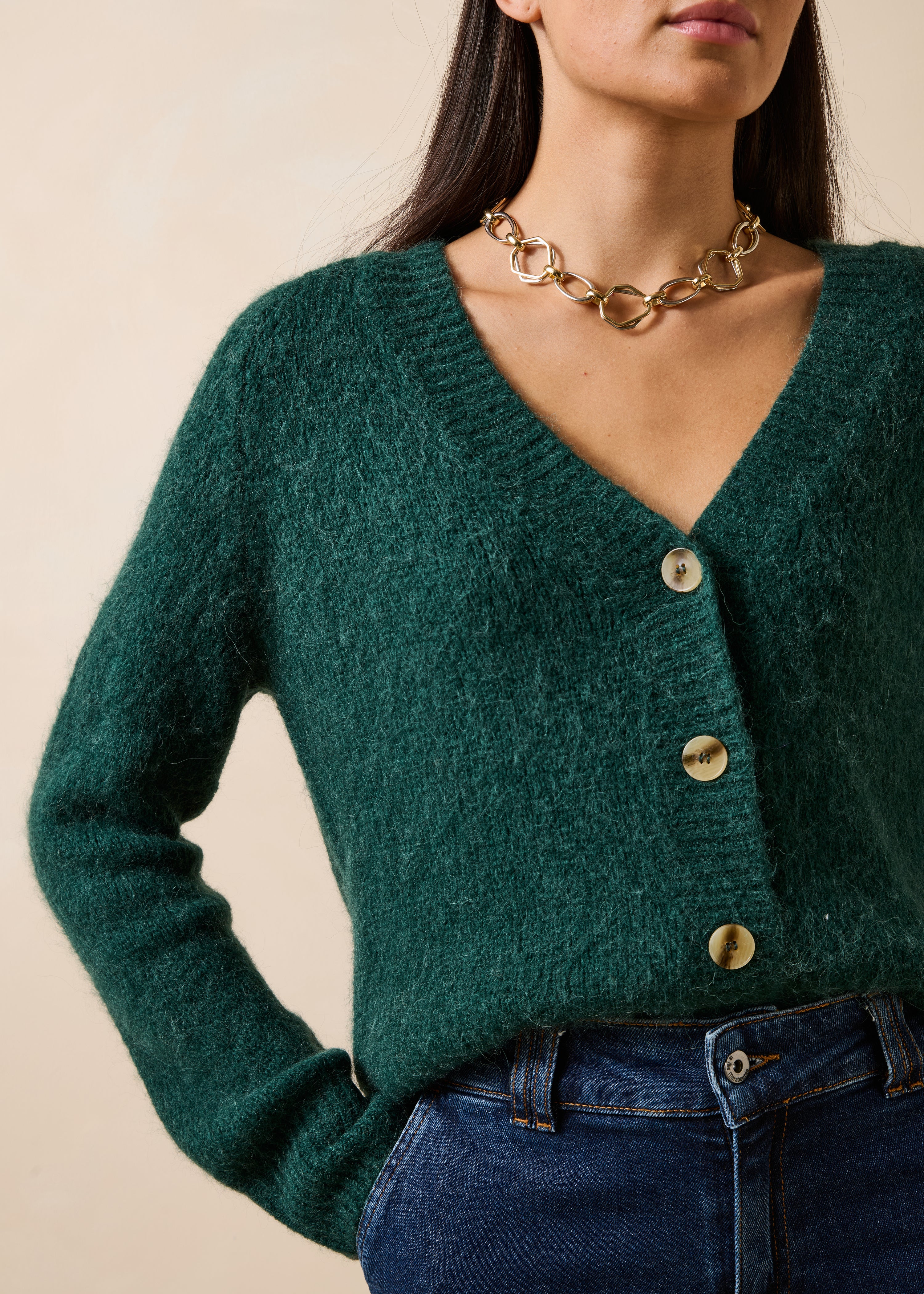 Groene gilet met lange mouwen en V-hals