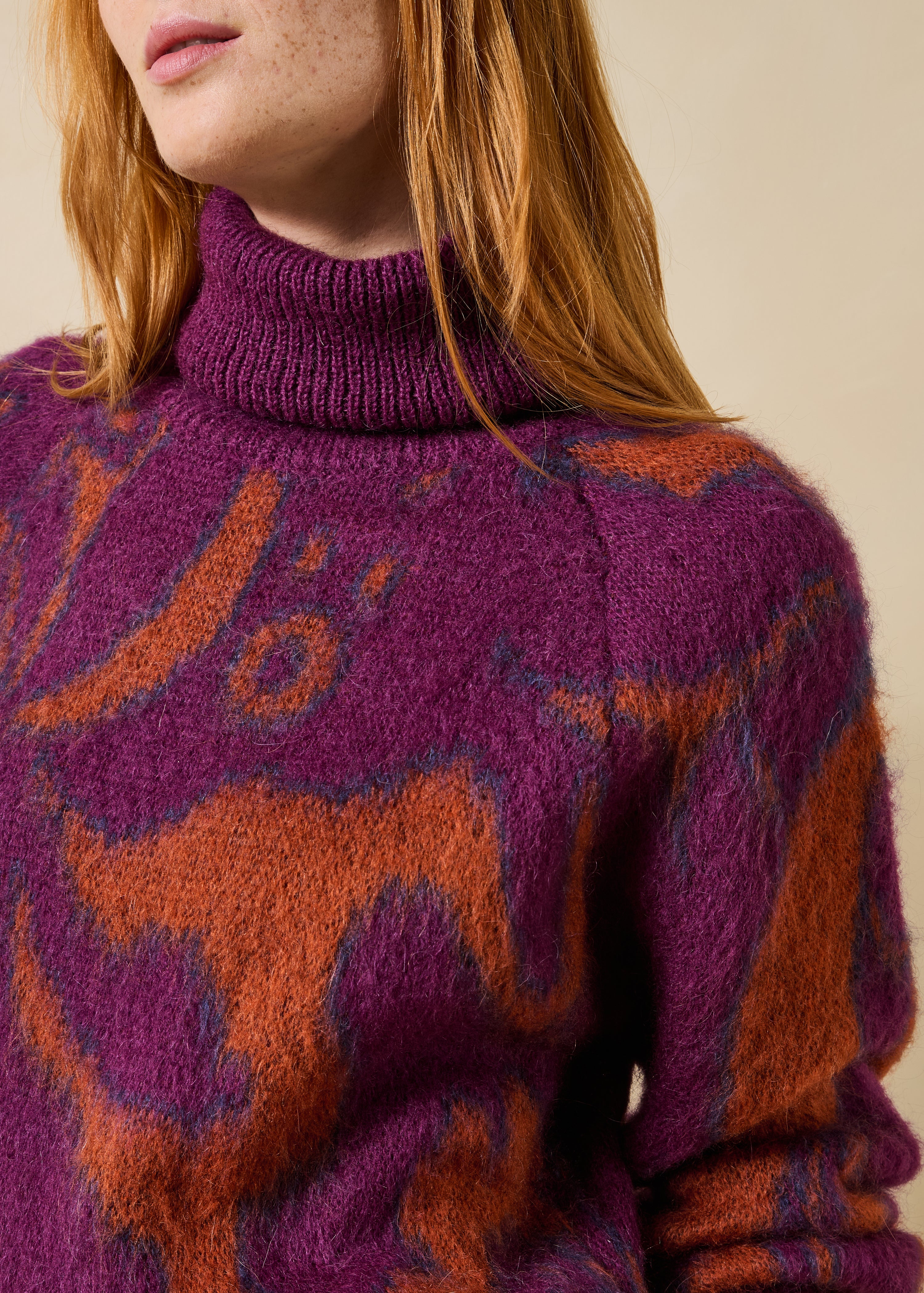 Purple and orange jacquard turtleneck sweater