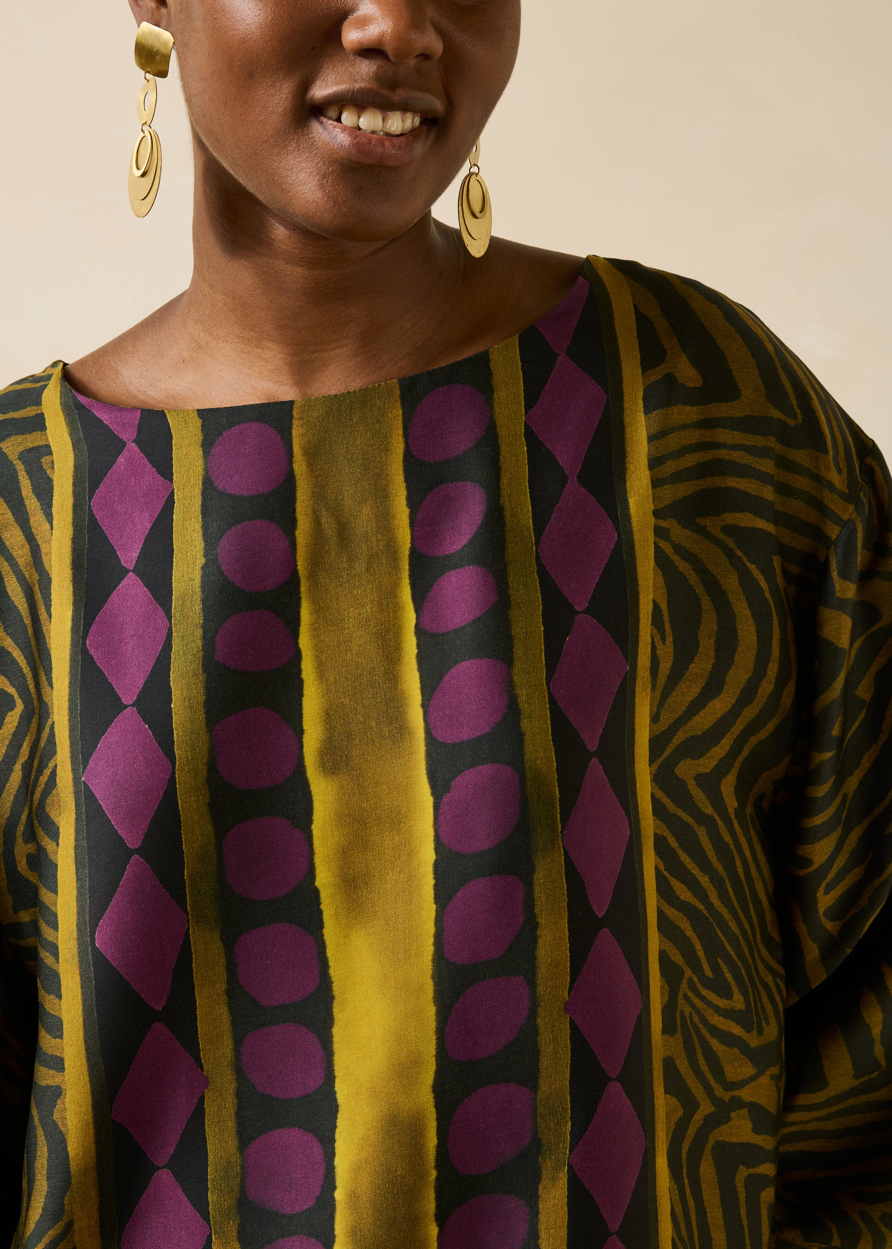 Loose black and ochre fluid top with long printed sleeves
