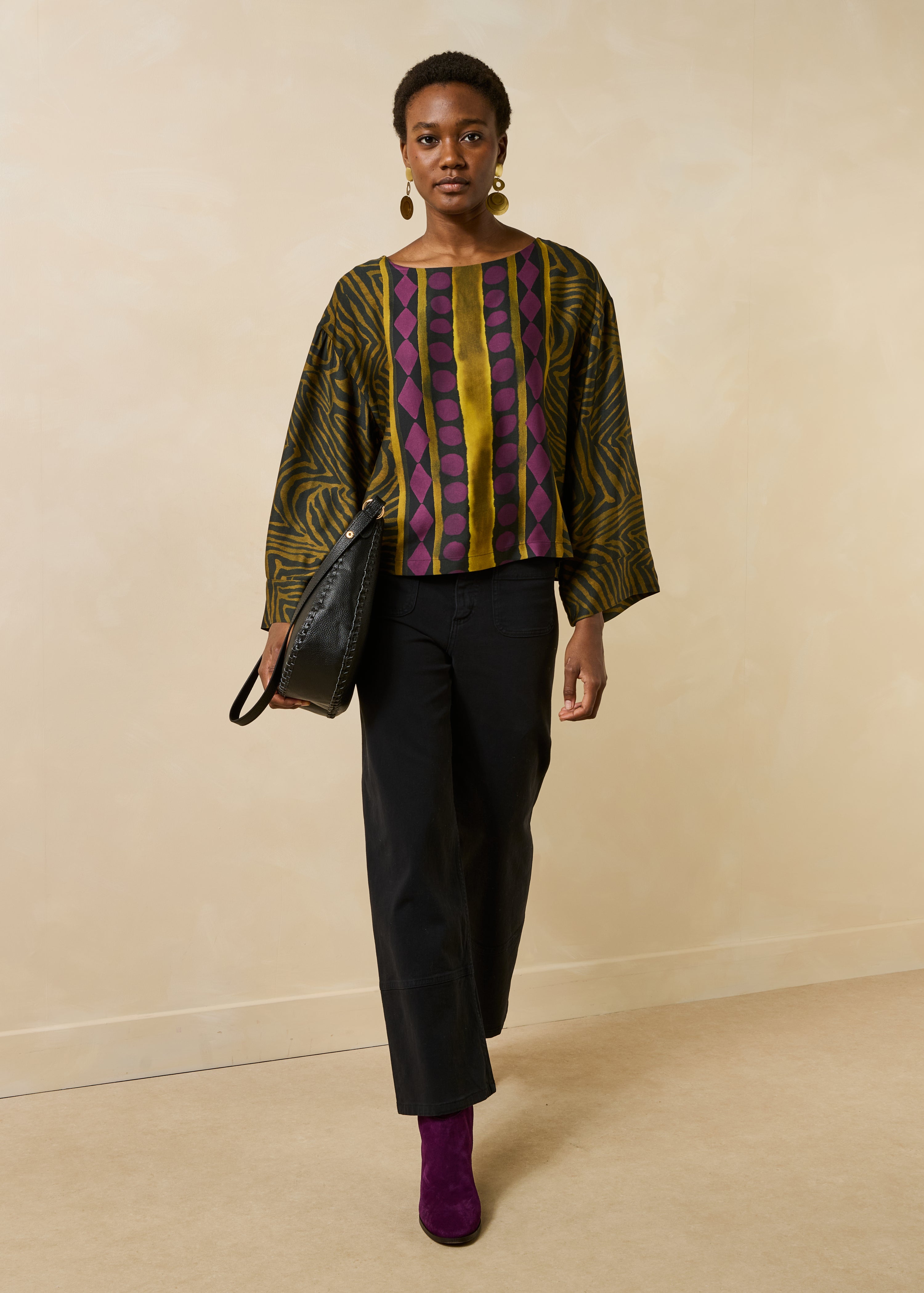 Loose black and ochre fluid top with long printed sleeves
